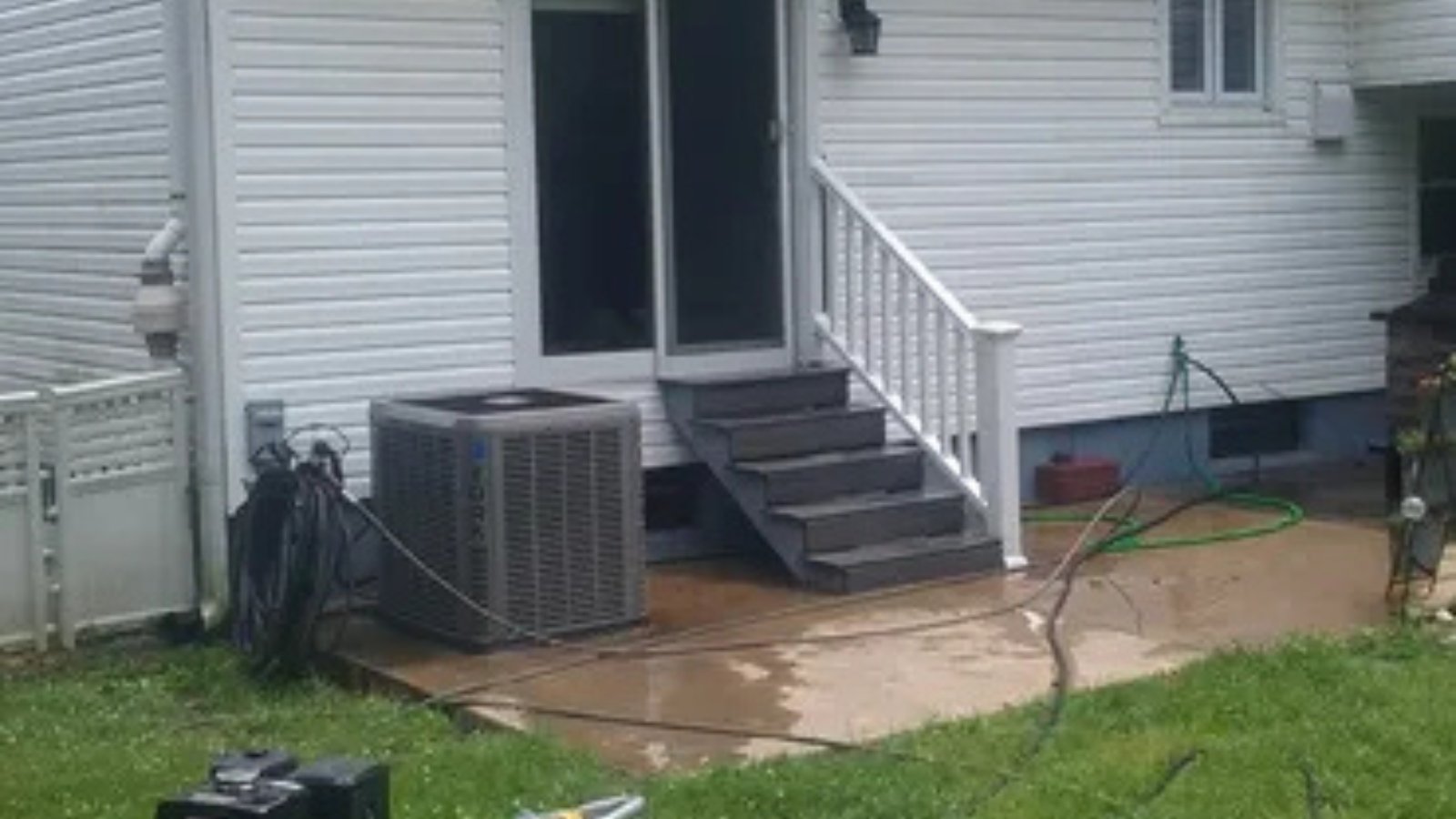 Power washing a residential home in Philadelphia to clean siding and prepare surfaces for painting.